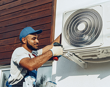 man working on a/c unit