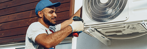 man working on a/c unit