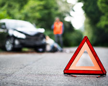 caution sign in front of car accident