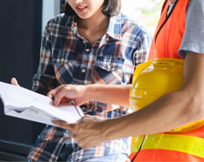 construction works going through paperwork with client 