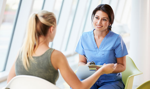 nurse communicating with patient